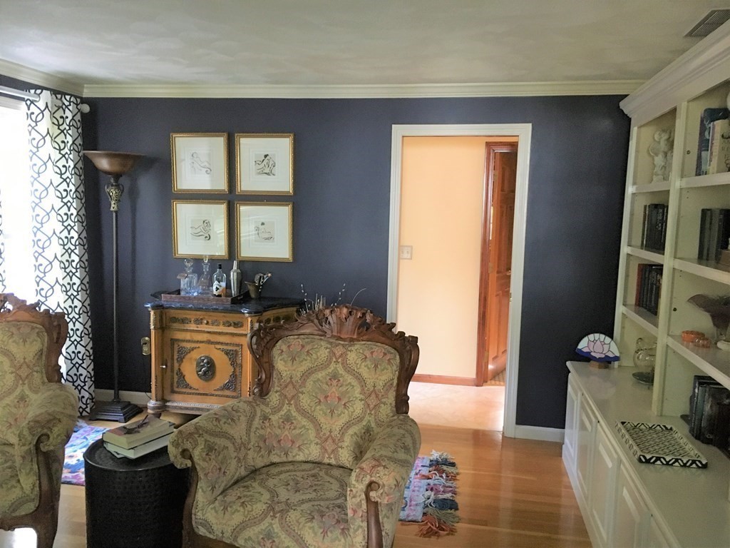 9 Virginia Ridge Road Sudbury, MA 01776 - Photo 16 of 40 a living room with furniture and a fireplace