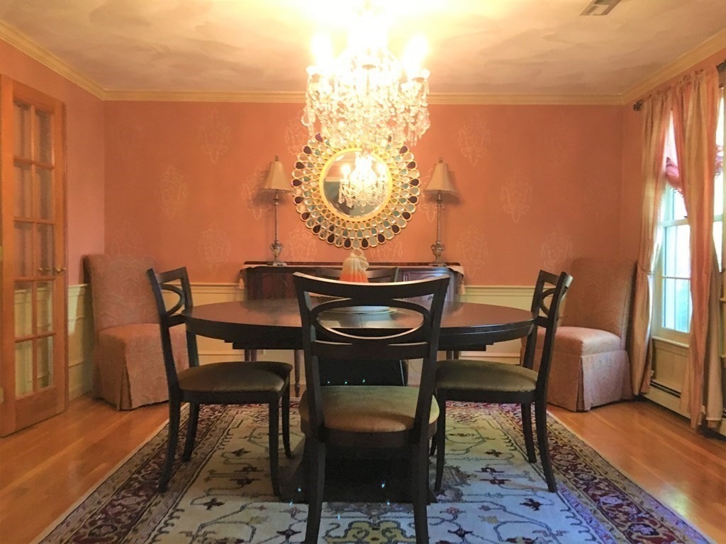 9 Virginia Ridge Road Sudbury, MA 01776 - Photo 18 of 40 a dining room with furniture and wooden floor
