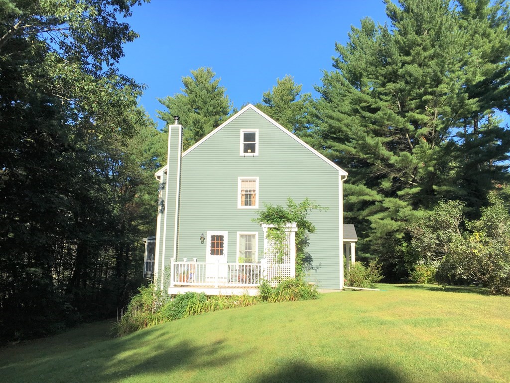9 Virginia Ridge Road Sudbury, MA 01776 - Photo 2 of 40 a front view of a house with a yard