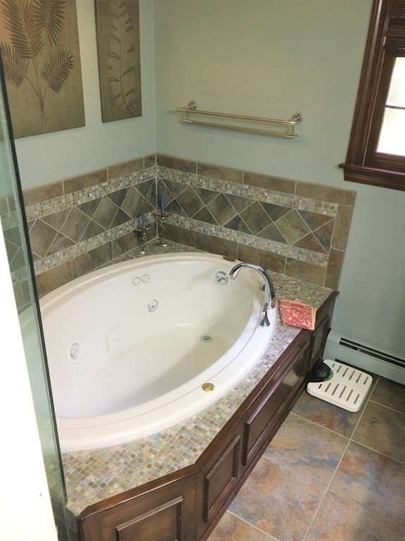 9 Virginia Ridge Road Sudbury, MA 01776 - Photo 25 of 40 a bath tub sitting in a bathroom next to a window