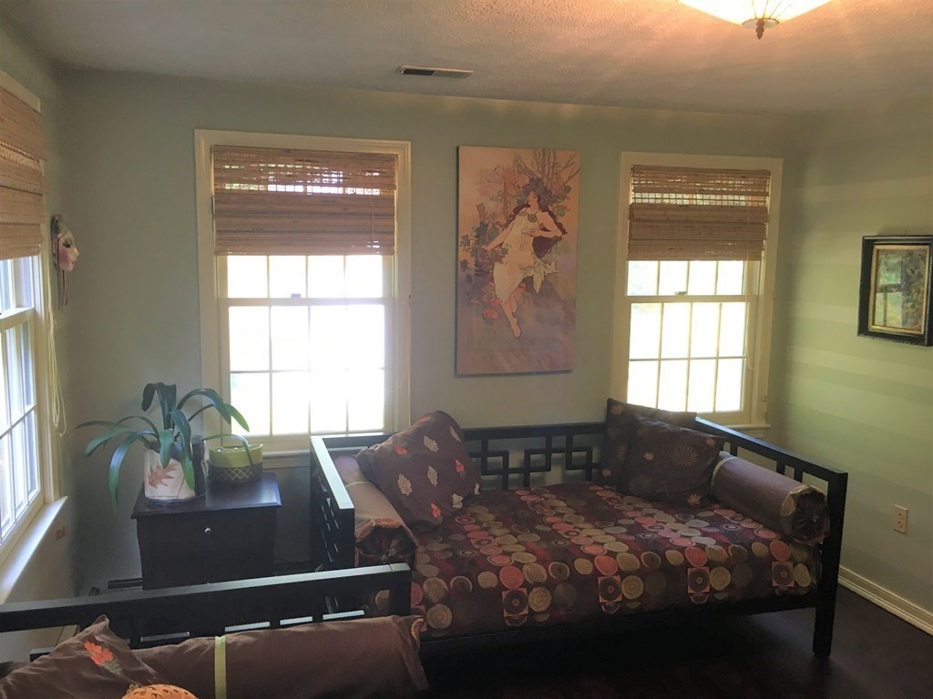 9 Virginia Ridge Road Sudbury, MA 01776 - Photo 28 of 40 a bed sitting in a bedroom next to a window