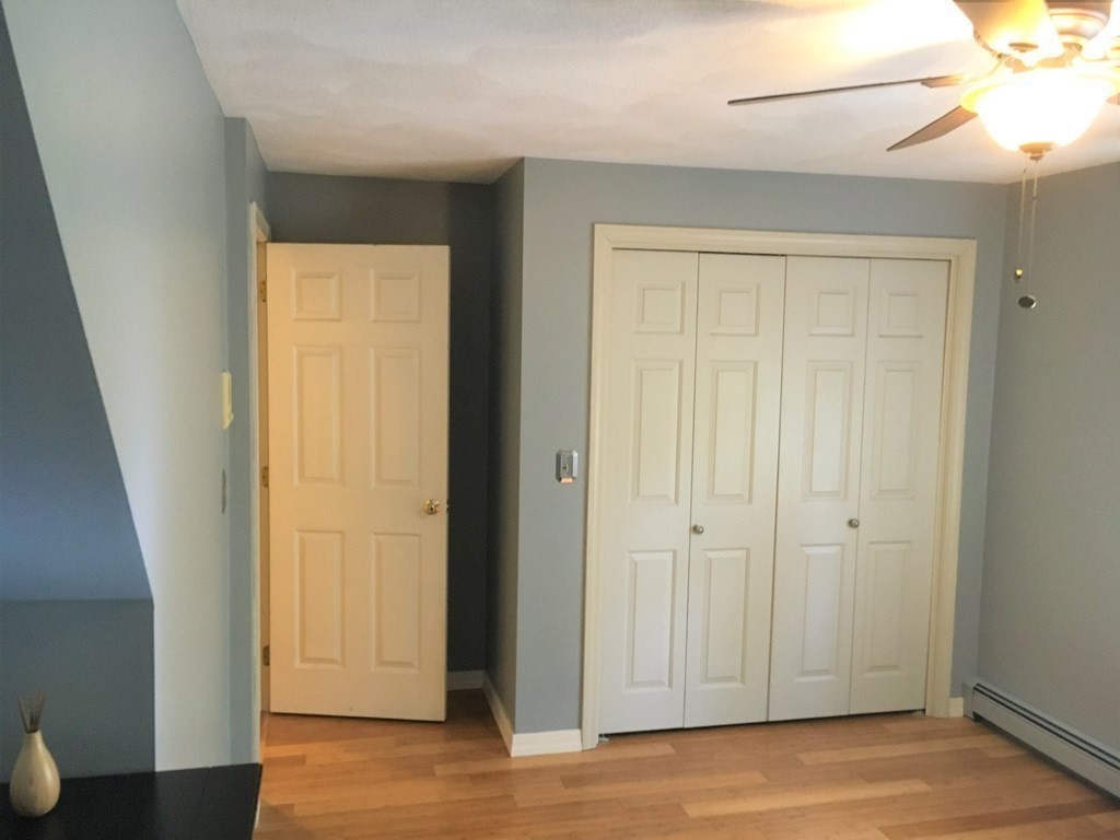 9 Virginia Ridge Road Sudbury, MA 01776 - Photo 30 of 40 an empty room with wooden floor and closet area