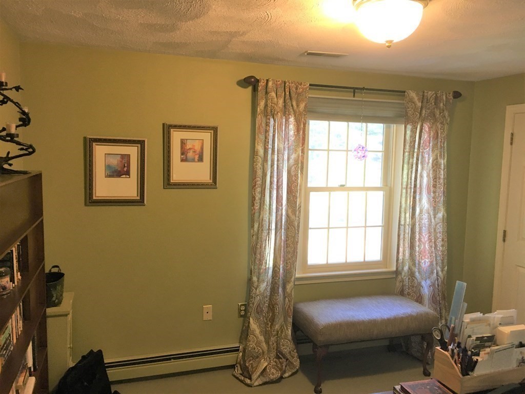 9 Virginia Ridge Road Sudbury, MA 01776 - Photo 32 of 40 a bedroom with a bed and a window