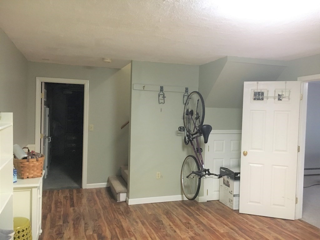 9 Virginia Ridge Road Sudbury, MA 01776 - Photo 37 of 40 a view of a room with wooden floor and closet