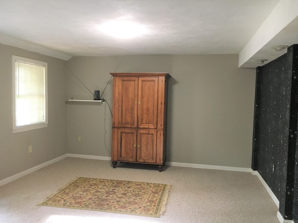 9 Virginia Ridge Road Sudbury, MA 01776 - Photo 38 of 40 a view of a room with a wooden door
