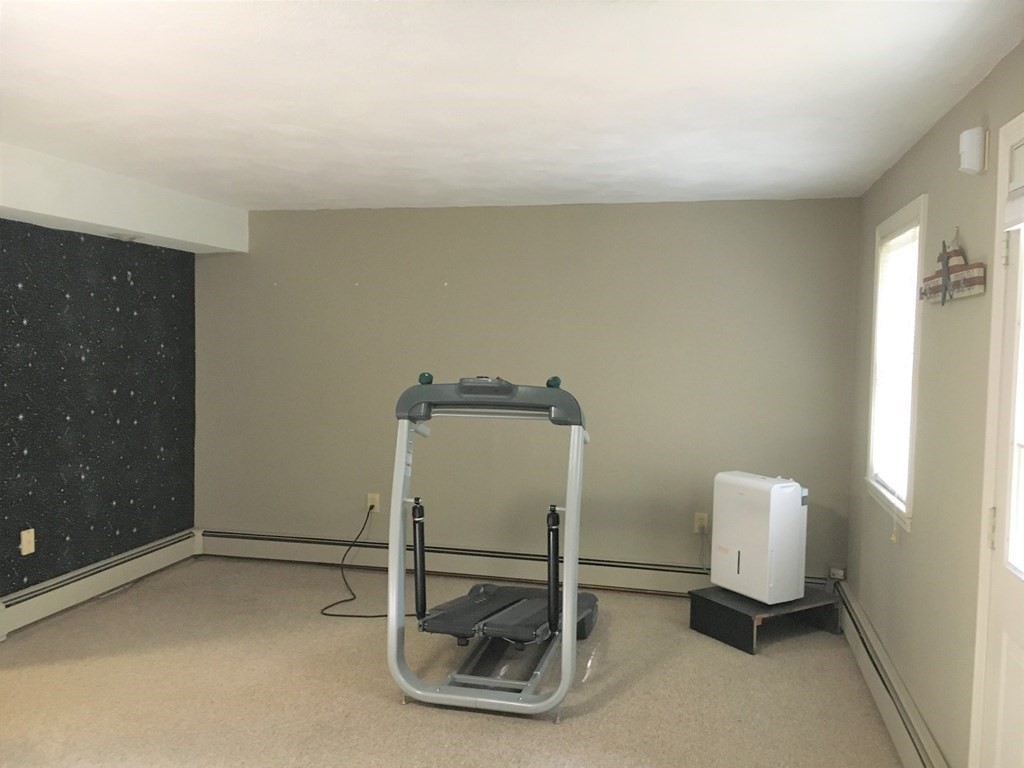 9 Virginia Ridge Road Sudbury, MA 01776 - Photo 39 of 40 a room with a chair and a table