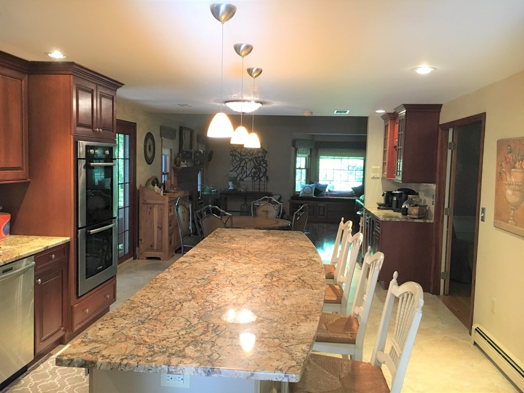 9 Virginia Ridge Road Sudbury, MA 01776 - Photo 5 of 40 a view of a kitchen with refrigerator and windows