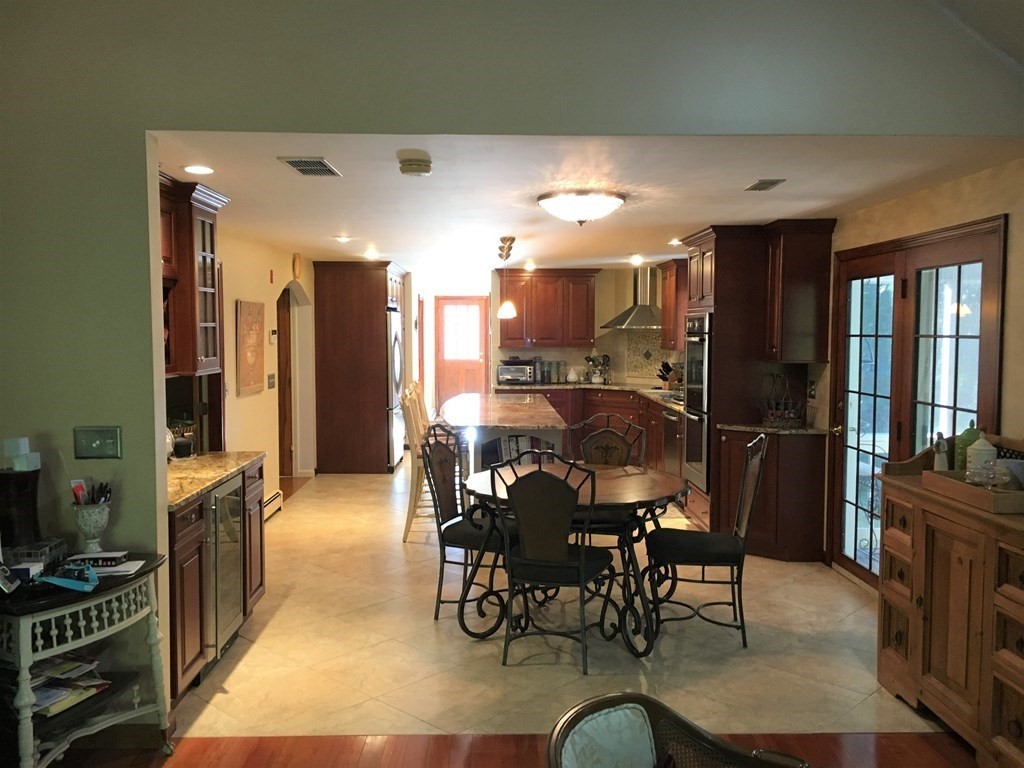9 Virginia Ridge Road Sudbury, MA 01776 - Photo 6 of 40 a dining room with furniture and kitchen view