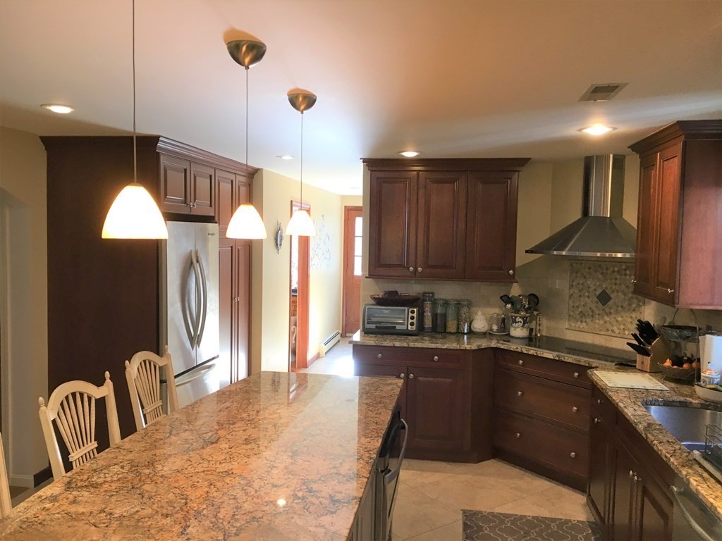 9 Virginia Ridge Road Sudbury, MA 01776 - Photo 7 of 40 a kitchen with granite countertop a sink a counter top space appliances and cabinets