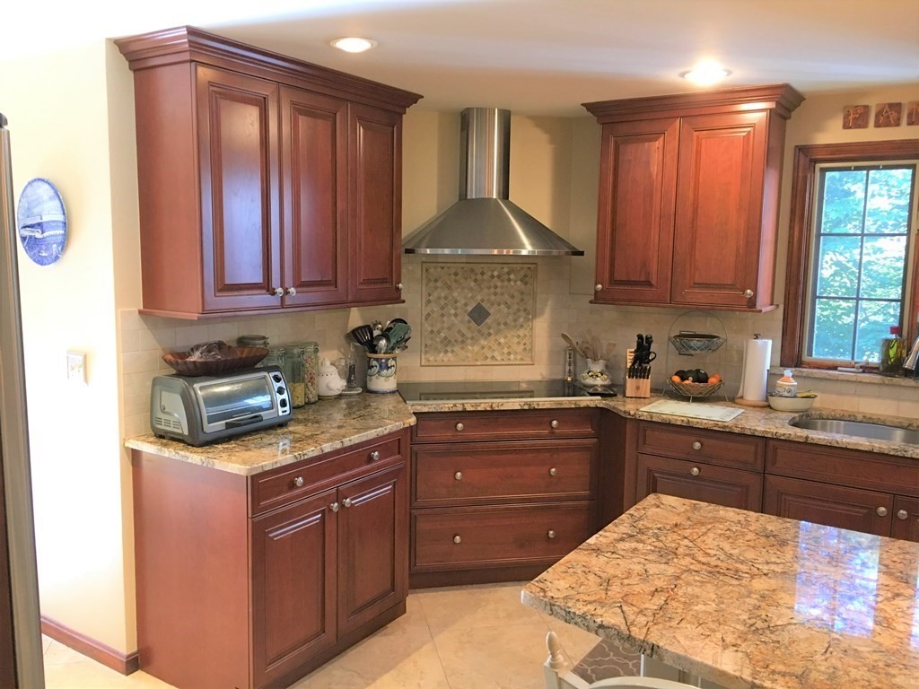 9 Virginia Ridge Road Sudbury, MA 01776 - Photo 8 of 40 a kitchen with stainless steel appliances granite countertop a stove a sink dishwasher and cabinets