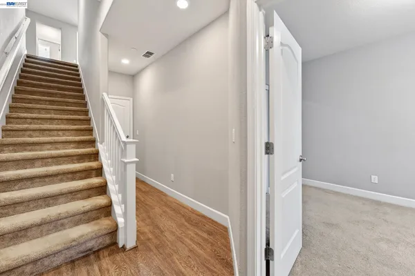 a view of entryway with wooden floor
