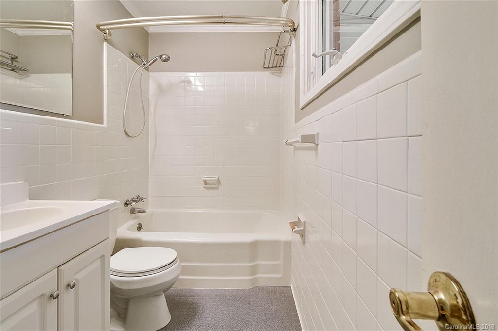 5523 Seacroft Road Charlotte, NC 28210 - Photo 13 of 15 a bathroom with a toilet a sink and bathtub