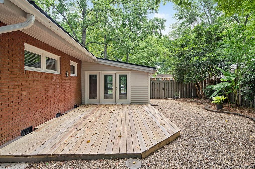 5523 Seacroft Road Charlotte, NC 28210 - Photo 14 of 15 a wooden house with trees in front of it