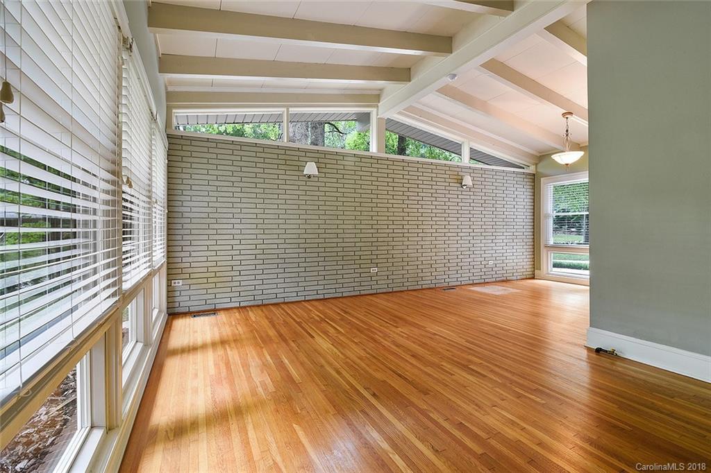 5523 Seacroft Road Charlotte, NC 28210 - Photo 6 of 15 a view of a room with wooden floor and a window