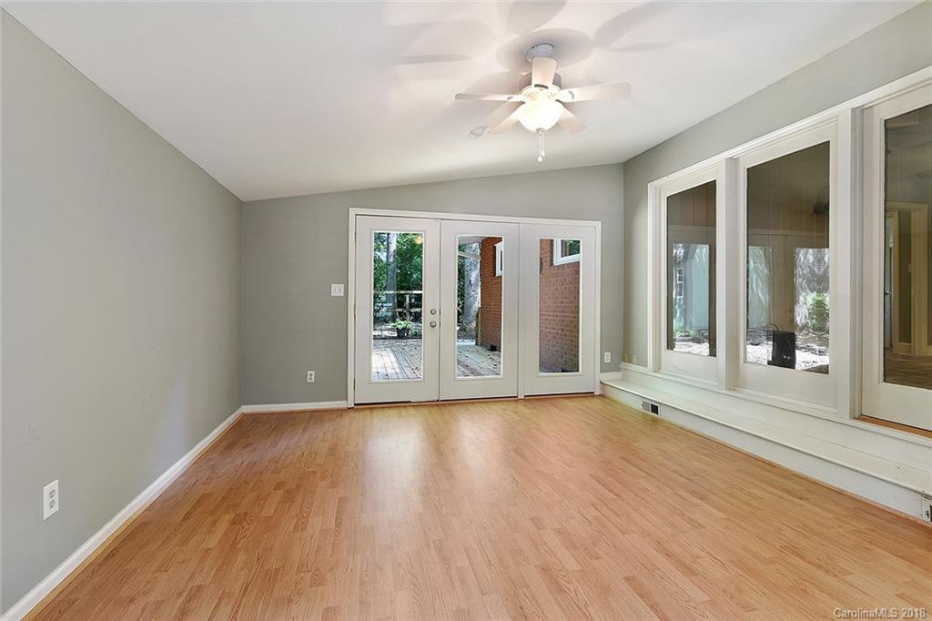 5523 Seacroft Road Charlotte, NC 28210 - Photo 8 of 15 wooden floor in an empty room with a window