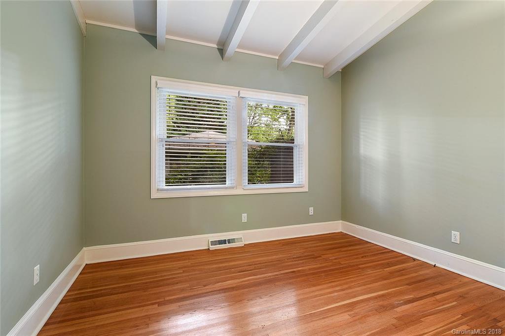 5523 Seacroft Road Charlotte, NC 28210 - Photo 9 of 15 a view of a room with wooden floor and windows