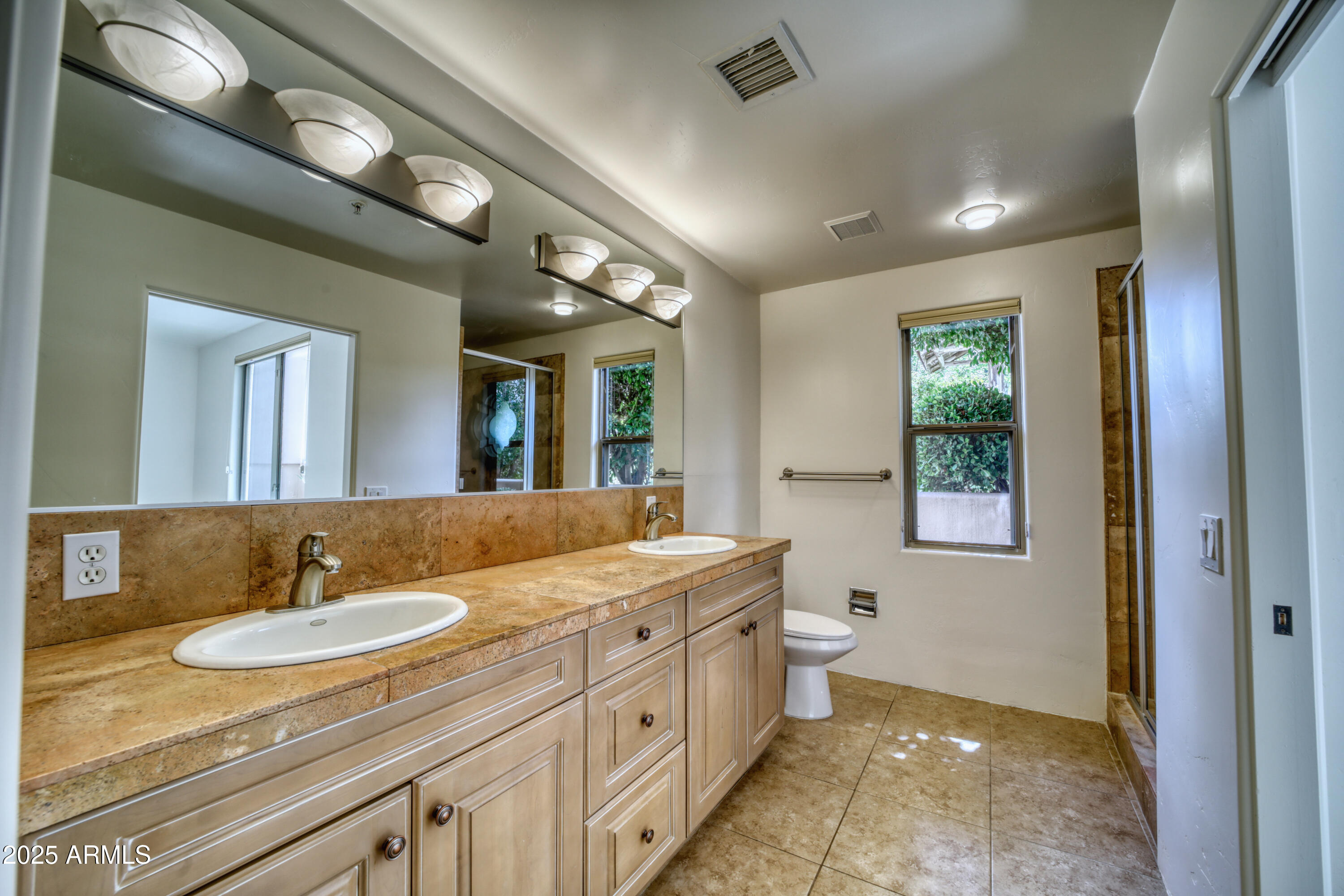 520 Jordan Road, Unit 4 Sedona, AZ 86336 - Photo 16 of 29 a bathroom with a granite countertop sink mirror and a bathtub