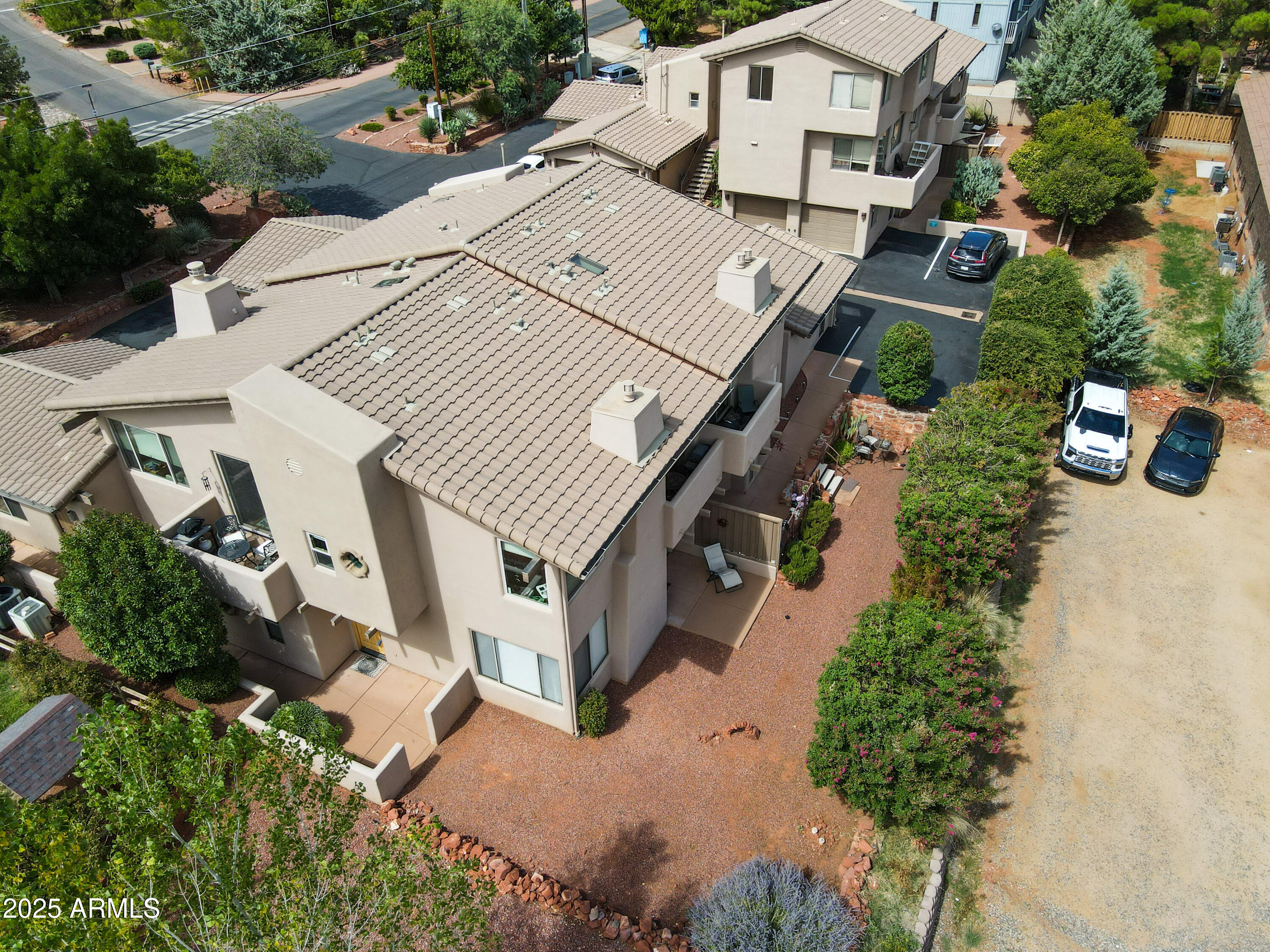 520 Jordan Road, Unit 4 Sedona, AZ 86336 - Photo 2 of 29 an aerial view of multiple houses with yard