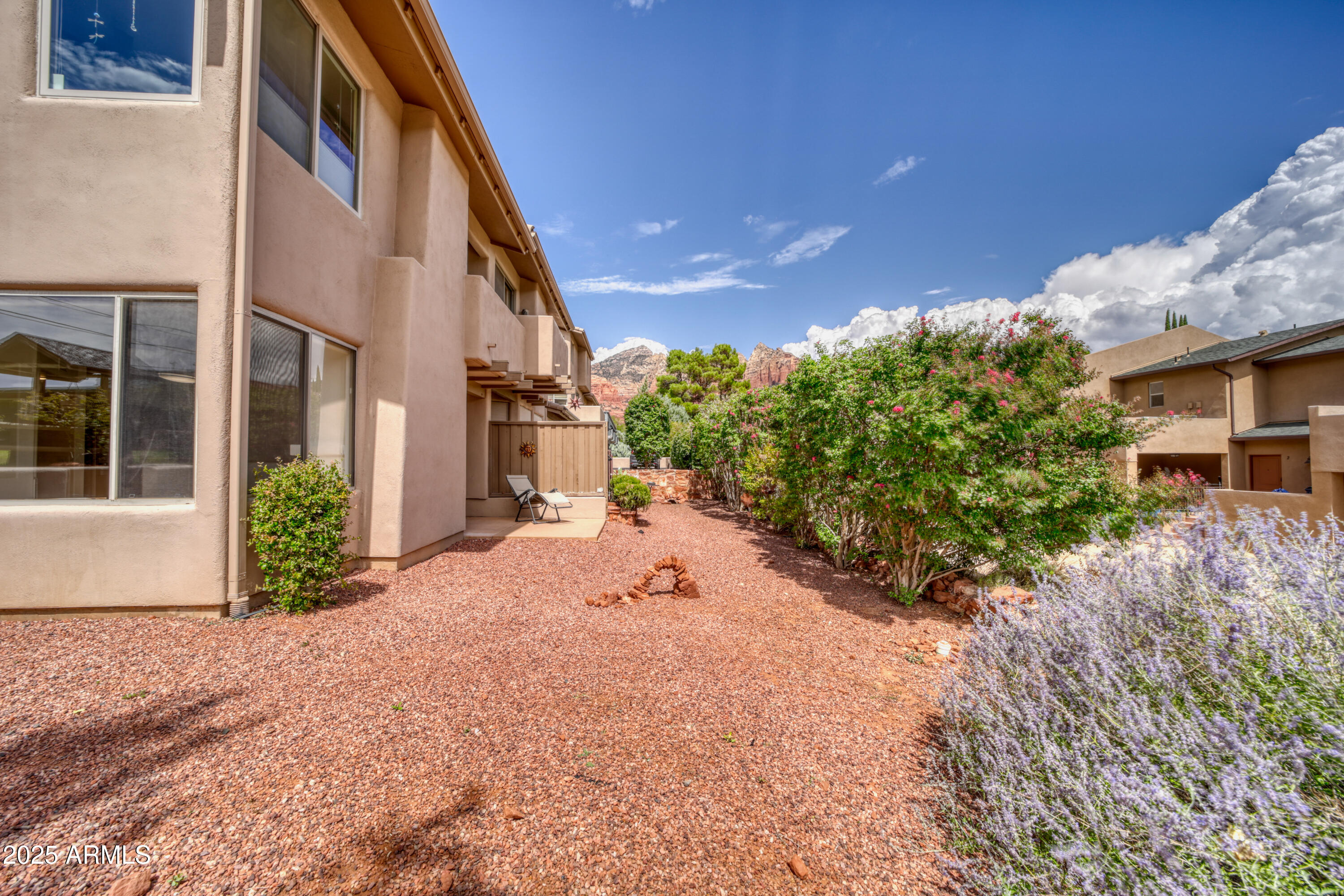 520 Jordan Road, Unit 4 Sedona, AZ 86336 - Photo 24 of 29 a view of a house with a yard and potted plants