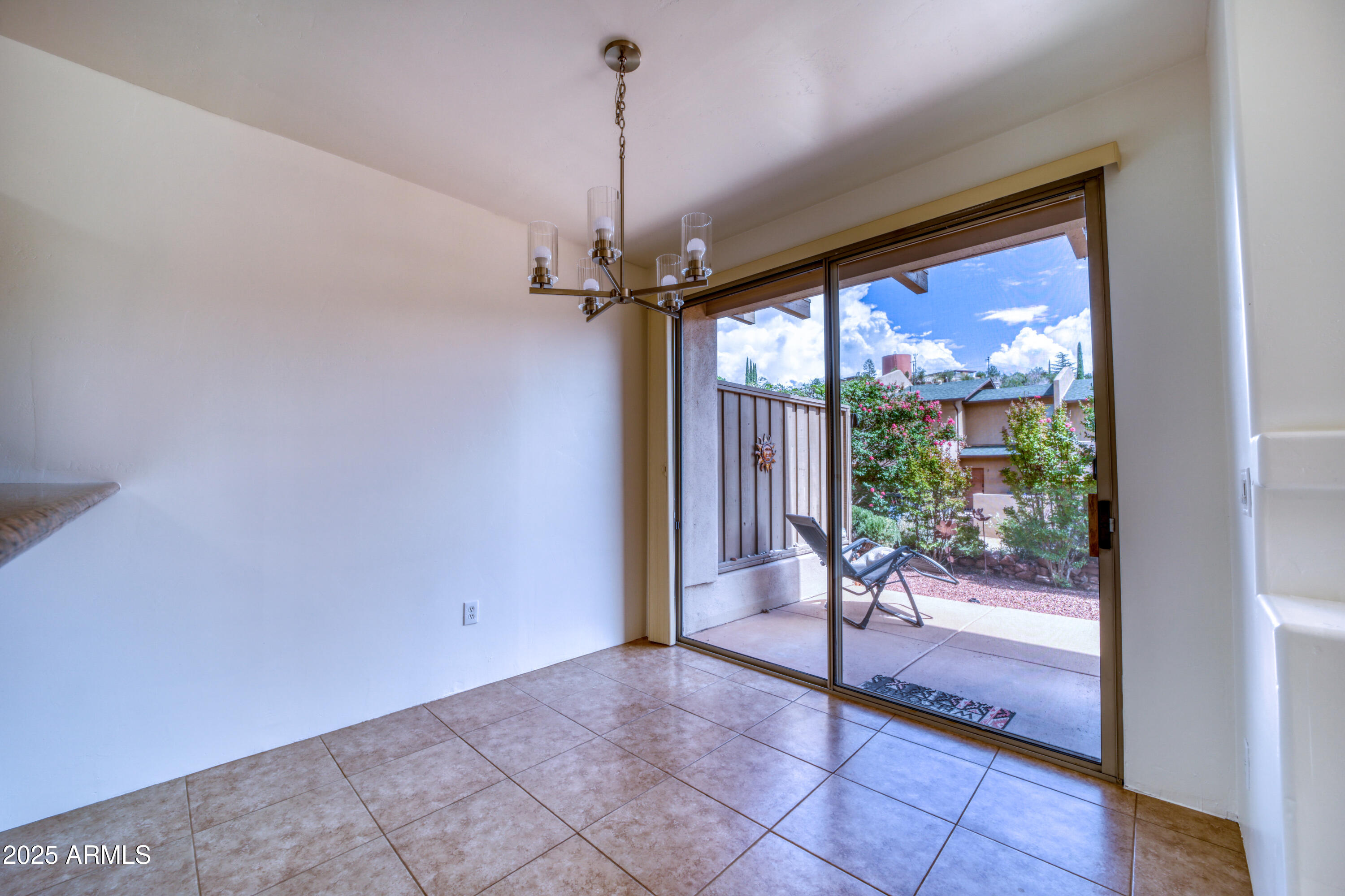 520 Jordan Road, Unit 4 Sedona, AZ 86336 - Photo 8 of 29 a view of a room with a chandelier and glass door