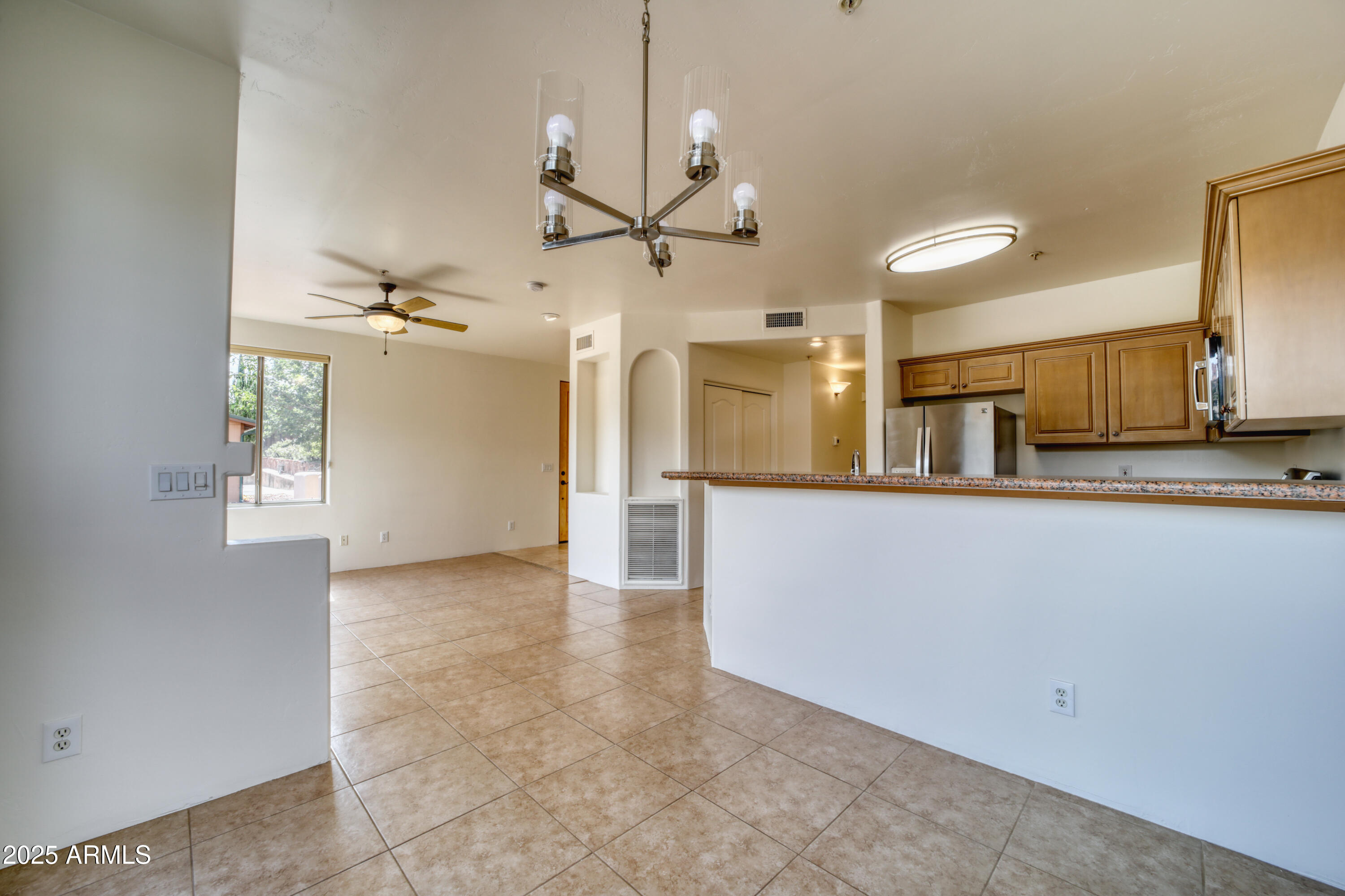 520 Jordan Road, Unit 4 Sedona, AZ 86336 - Photo 9 of 29 a view of a kitchen with a sink and refrigerator