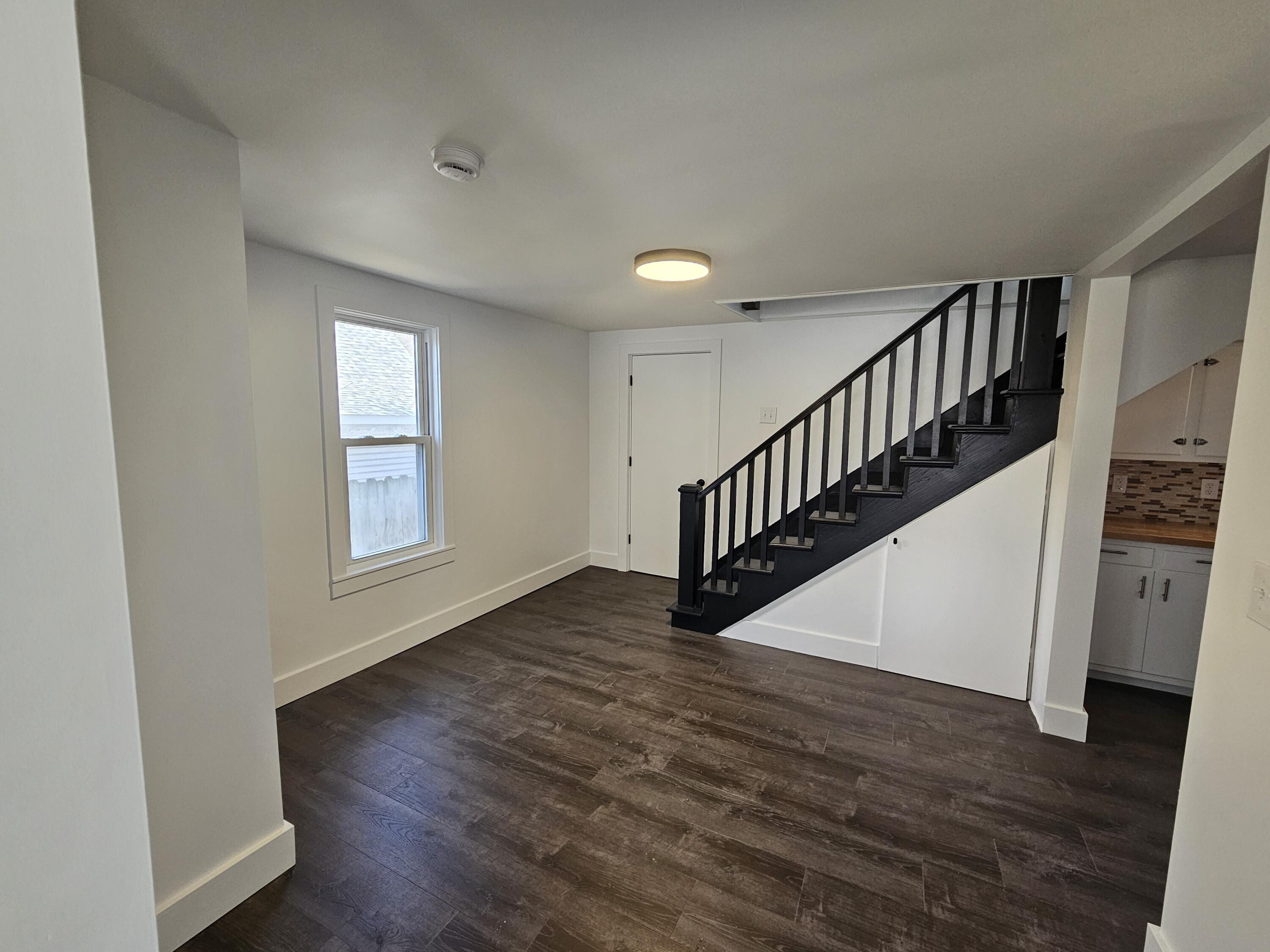 218 Fogarty Street Michigan City, IN 46360 - Photo 7 of 13 a view of entryway with wooden floor