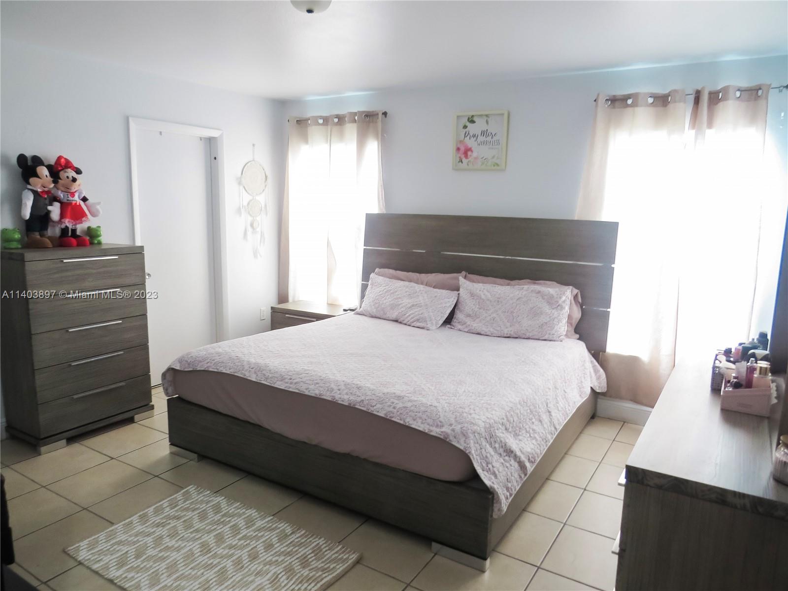 14225 Southwest 296th Street Homestead, FL 33033 - Photo 11 of 37 a bedroom with a bed and with furniture