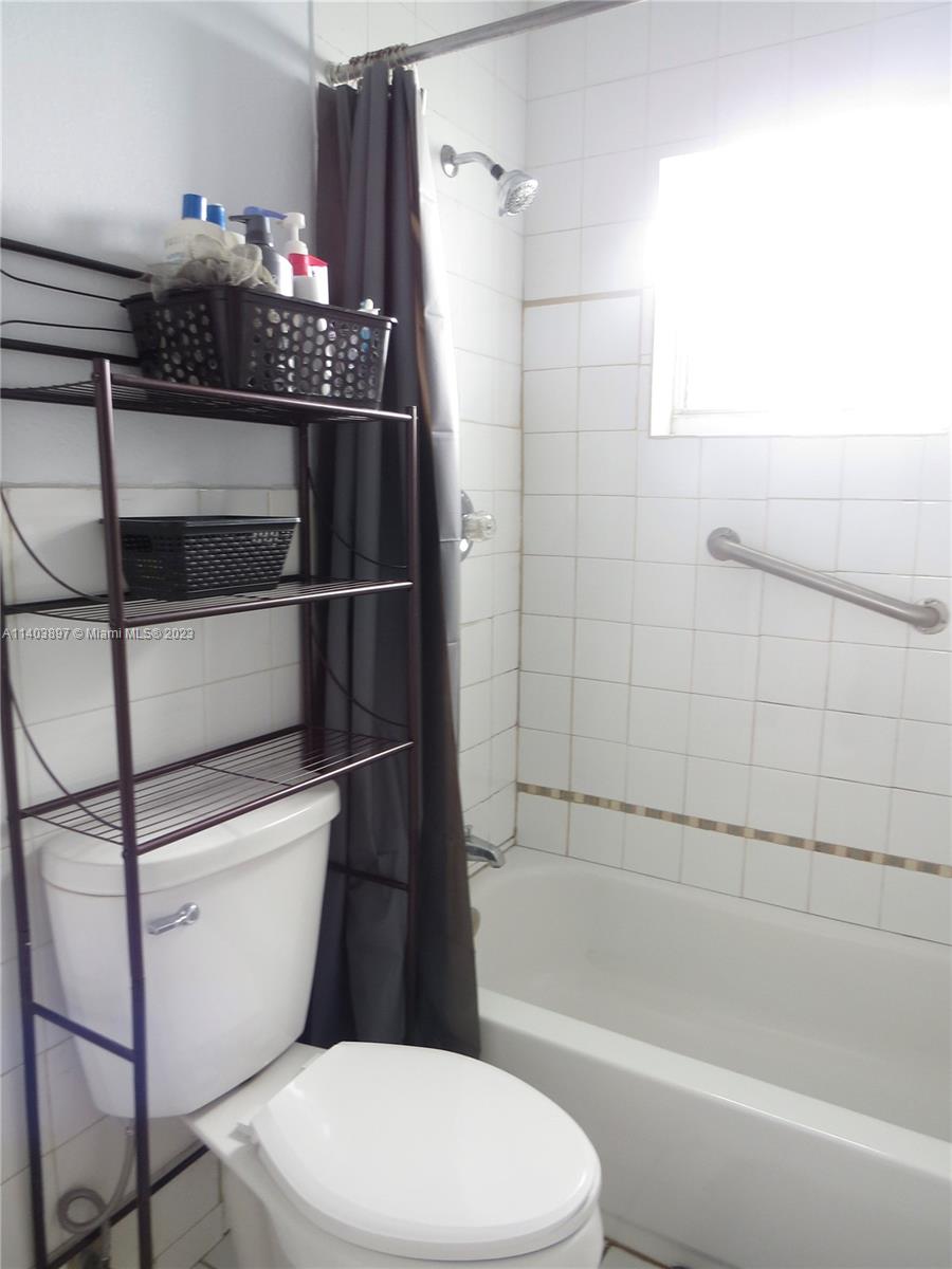 14225 Southwest 296th Street Homestead, FL 33033 - Photo 13 of 37 a bathroom with a toilet and a shower