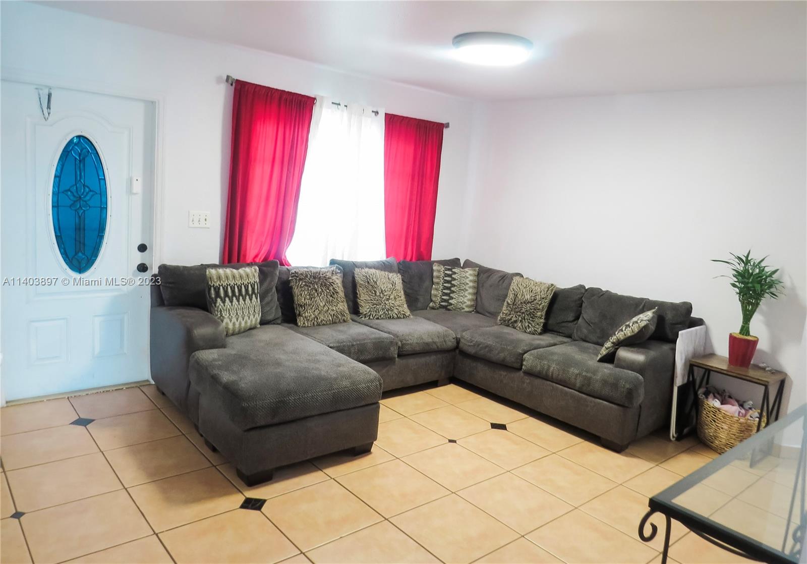 14225 Southwest 296th Street Homestead, FL 33033 - Photo 17 of 37 a living room with furniture and a window