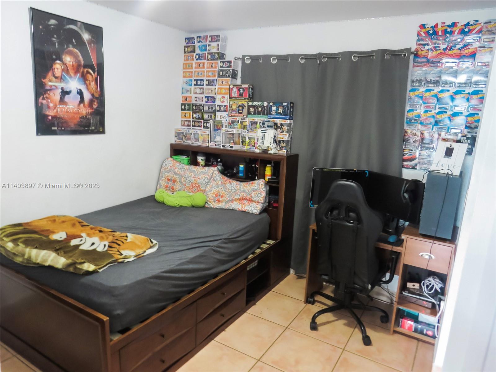14225 Southwest 296th Street Homestead, FL 33033 - Photo 21 of 37 a bedroom with a bed and furniture