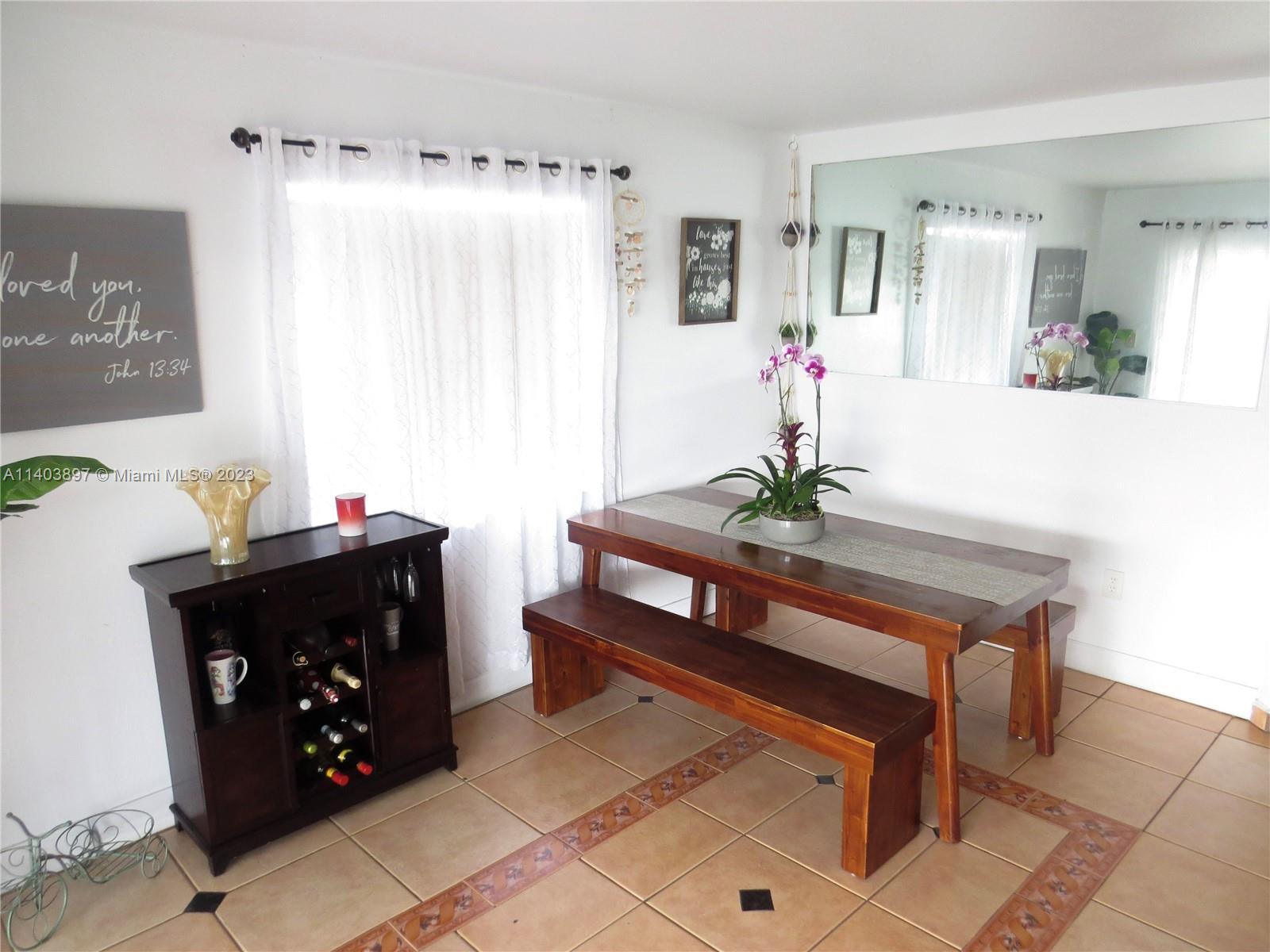 14225 Southwest 296th Street Homestead, FL 33033 - Photo 22 of 37 a living room with furniture and a mirror