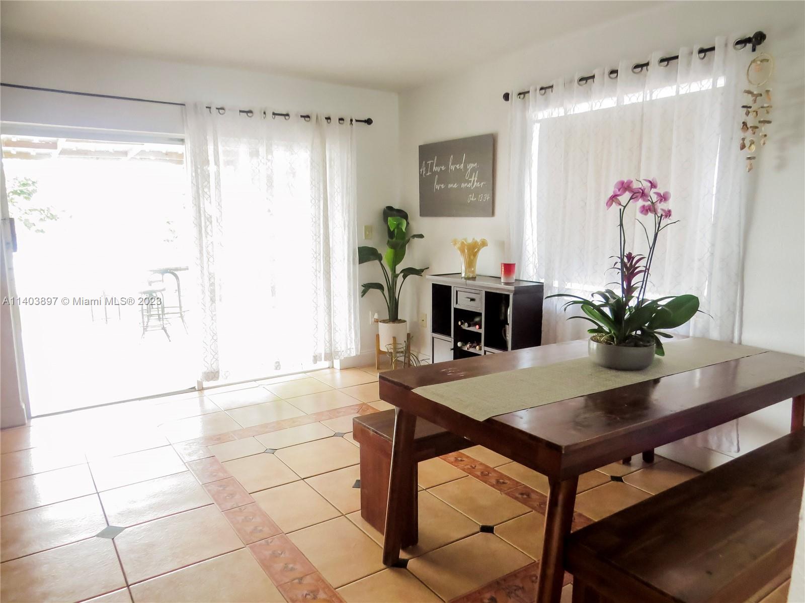 14225 Southwest 296th Street Homestead, FL 33033 - Photo 23 of 37 a view of a dining room with furniture