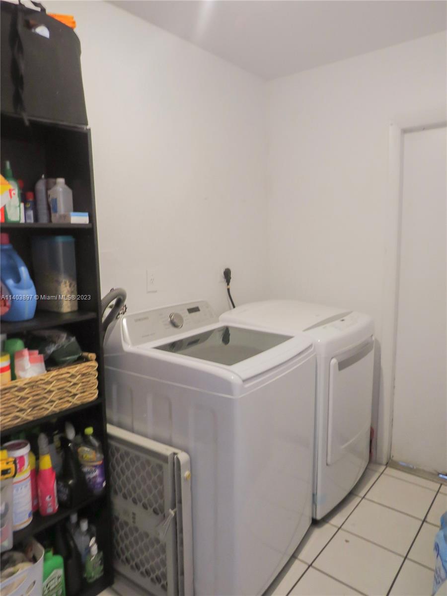 14225 Southwest 296th Street Homestead, FL 33033 - Photo 26 of 37 a utility room with dryer and washer