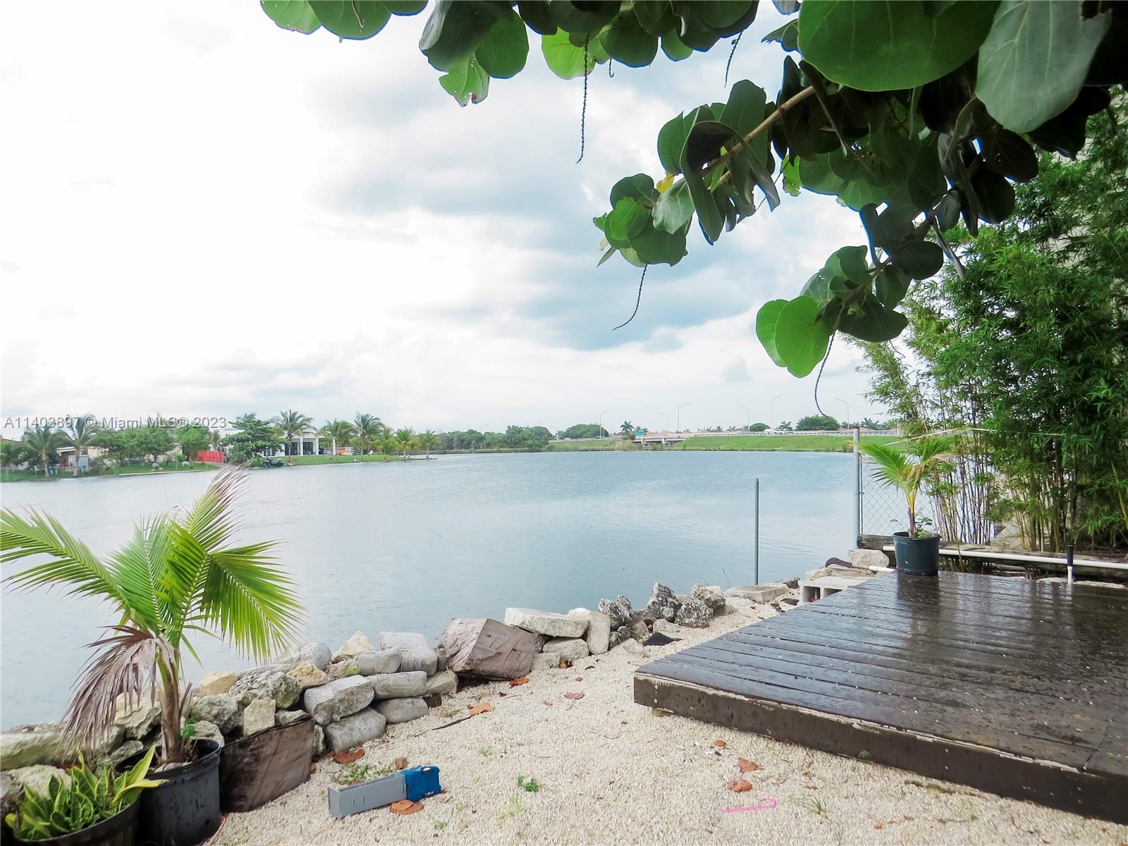 14225 Southwest 296th Street Homestead, FL 33033 - Photo 34 of 37 a view of a lake with a terrace