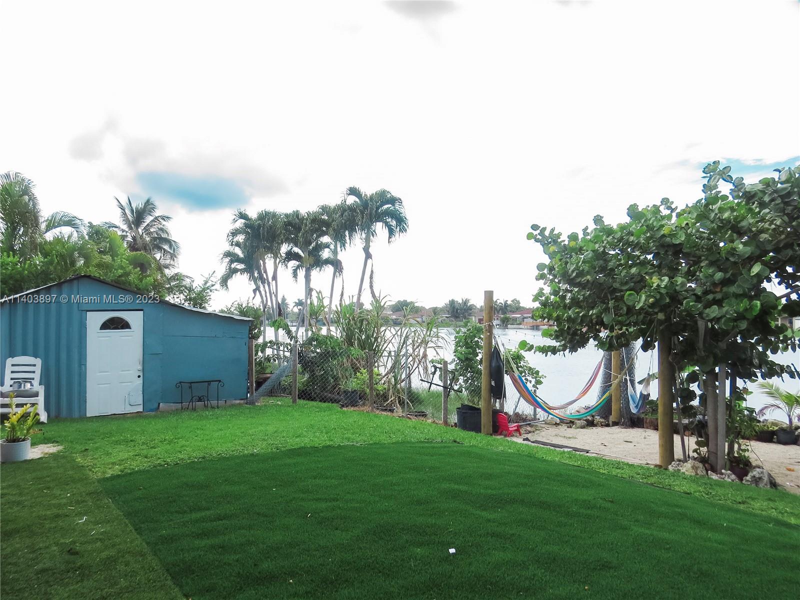 14225 Southwest 296th Street Homestead, FL 33033 - Photo 36 of 37 a view of a backyard with garden