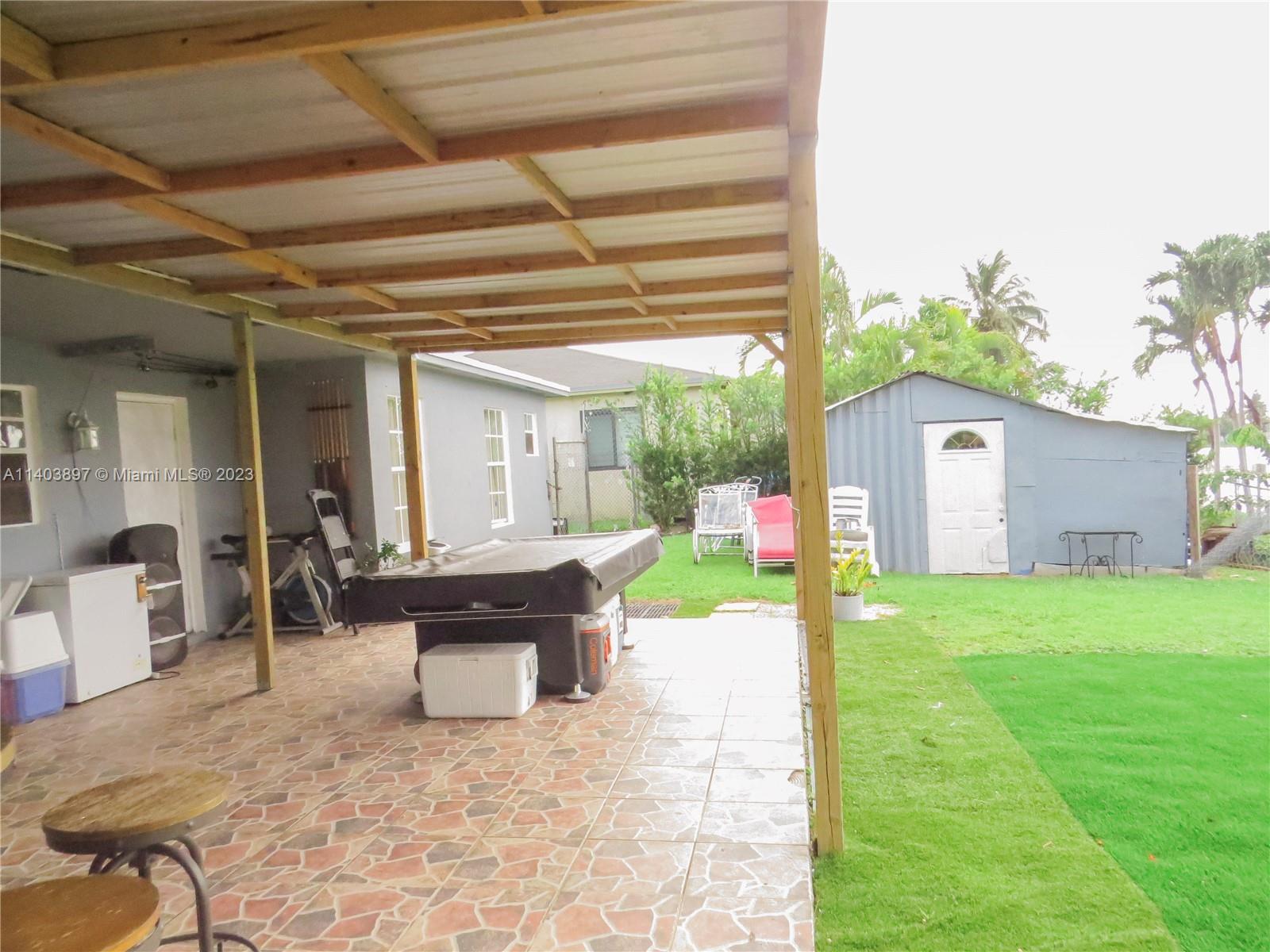 14225 Southwest 296th Street Homestead, FL 33033 - Photo 37 of 37 a view of a house with backyard and sitting area
