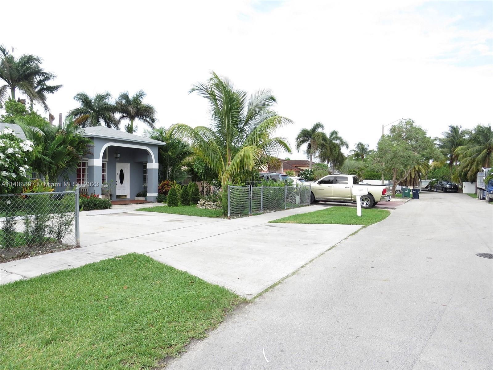 14225 Southwest 296th Street Homestead, FL 33033 - Photo 4 of 37 a house with garden in front of it
