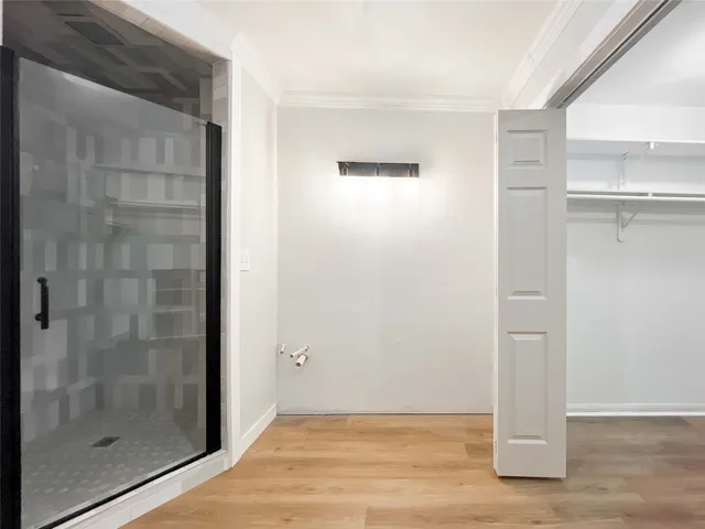 a view of a bathroom with wooden floor