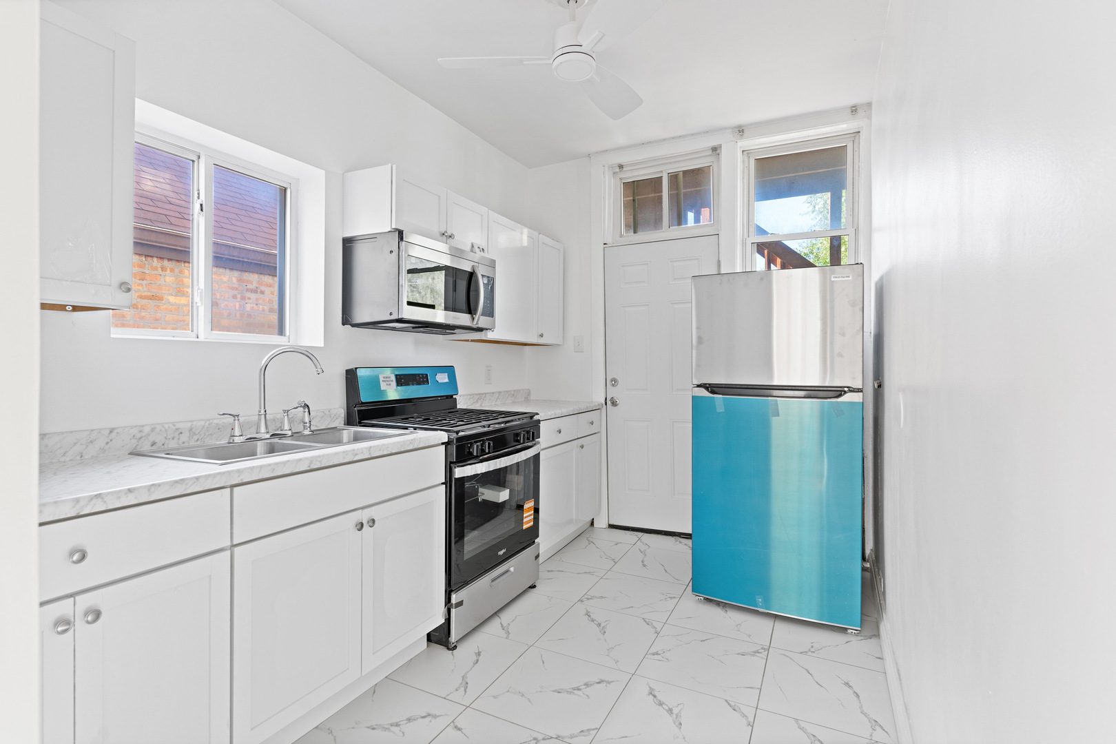 10342 South Calumet Avenue, Unit 2 Chicago, IL 60628 - Photo 16 of 25 a kitchen with a refrigerator and a sink