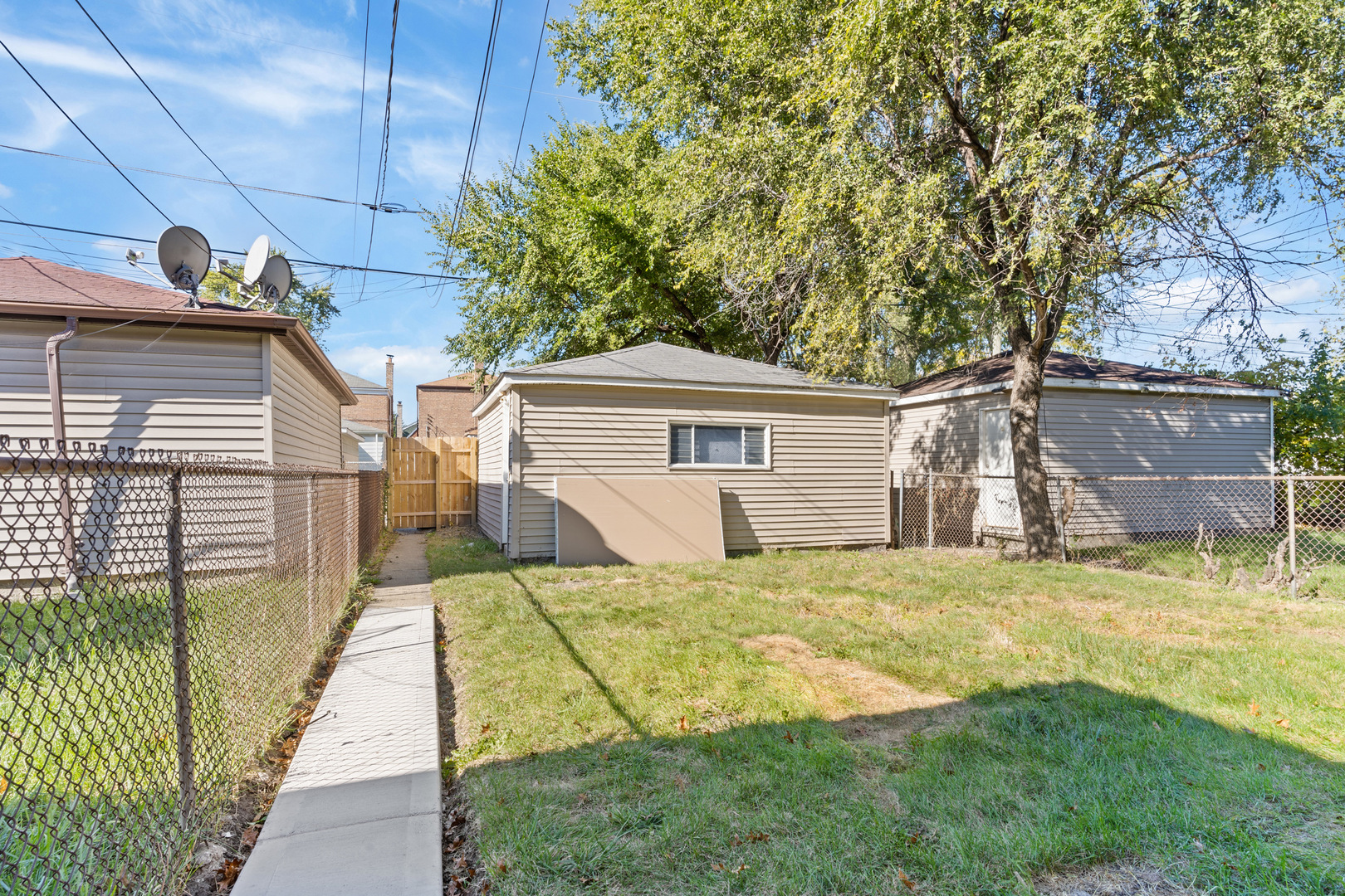 10342 South Calumet Avenue, Unit 2 Chicago, IL 60628 - Photo 25 of 25 a view of a house with backyard and sitting area