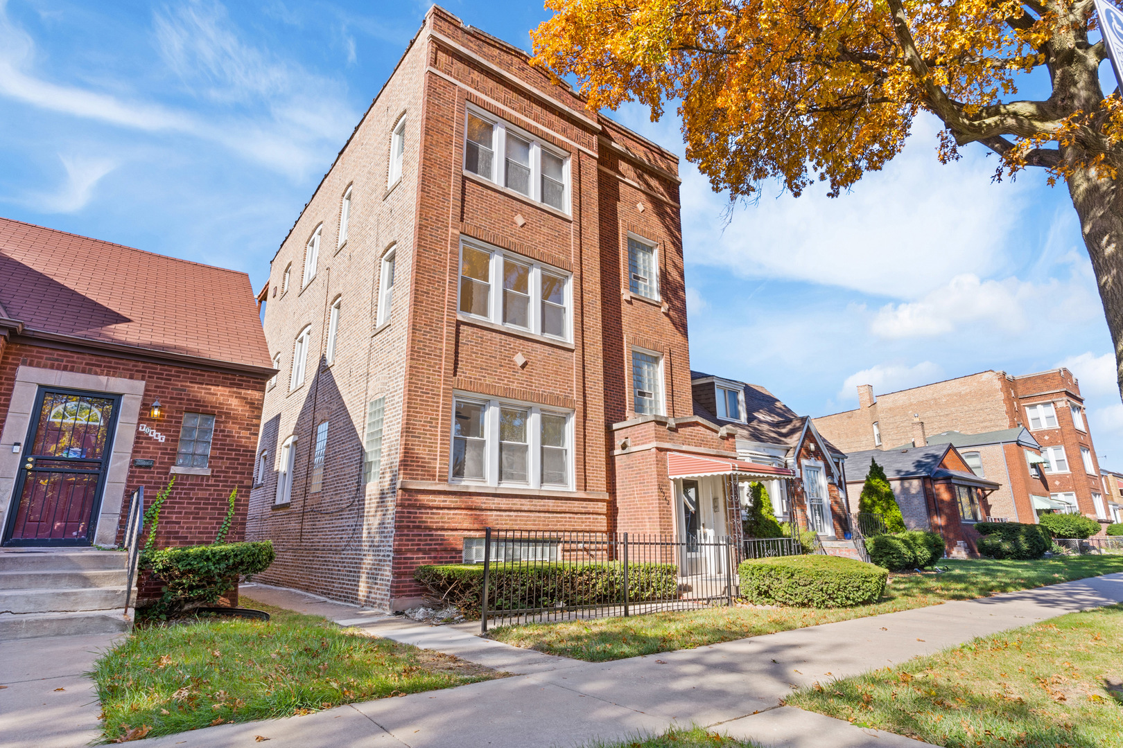 10342 South Calumet Avenue, Unit 2 Chicago, IL 60628 - Photo 3 of 25 a front view of a multi story residential apartment buildings