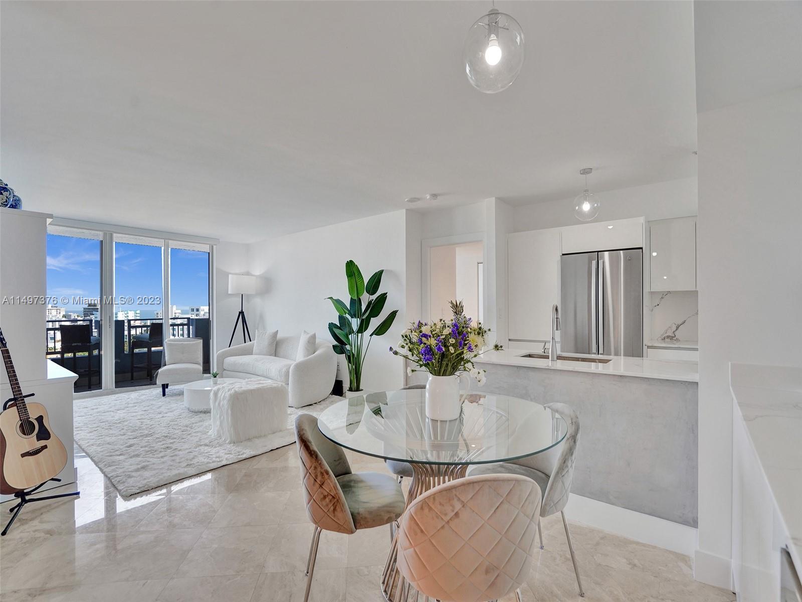 90 Alton Road, Unit 1109 Miami Beach, FL 33139 - Photo 1 of 23 a dining room with furniture and window