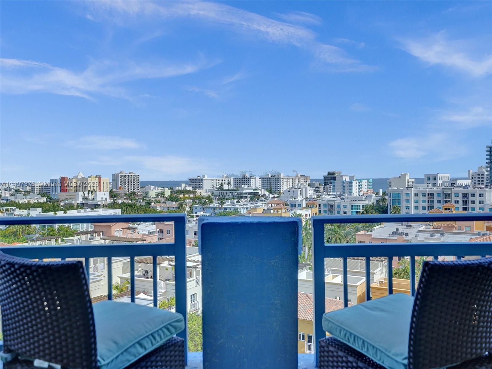 90 Alton Road, Unit 1109 Miami Beach, FL 33139 - Photo 15 of 23 a view of a chairs and table on the terrace