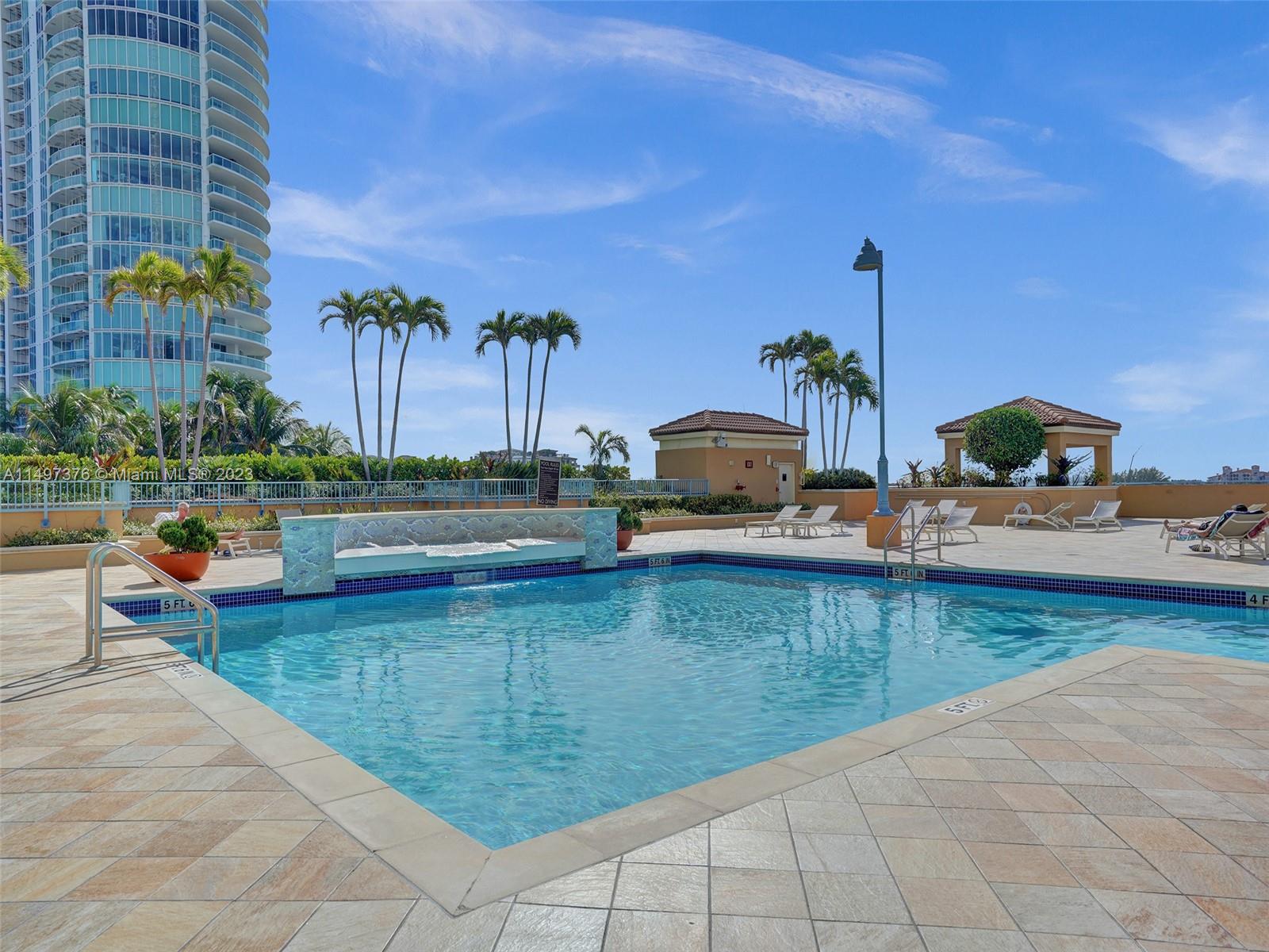 90 Alton Road, Unit 1109 Miami Beach, FL 33139 - Photo 17 of 23 a view of a swimming pool and a back yard
