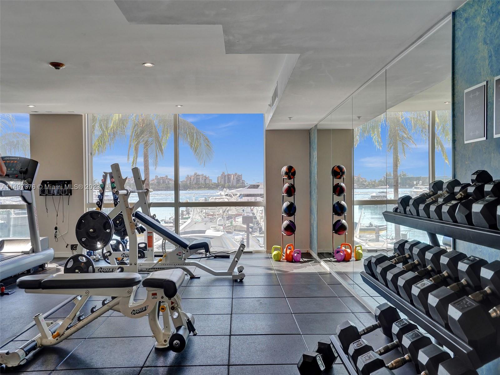 90 Alton Road, Unit 1109 Miami Beach, FL 33139 - Photo 19 of 23 a view of a room with gym equipment