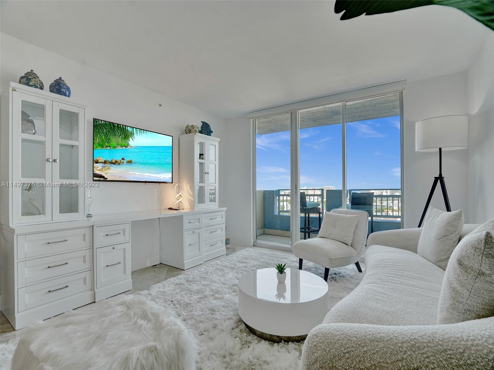 90 Alton Road, Unit 1109 Miami Beach, FL 33139 - Photo 2 of 23 a living room with furniture