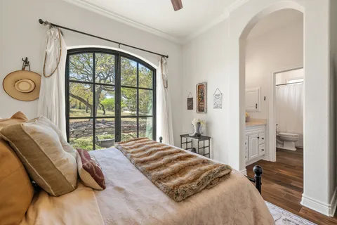 a bathroom with a granite countertop sink a toilet and a mirror