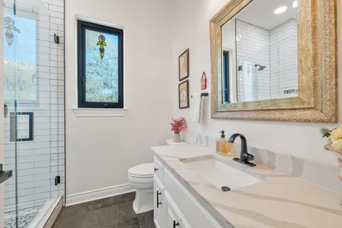 a kitchen with stainless steel appliances granite countertop a stove a sink and a counter space