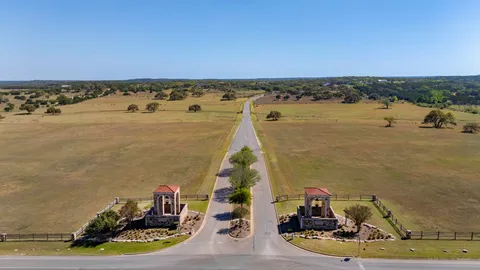 an aerial view of a residential houses with city view