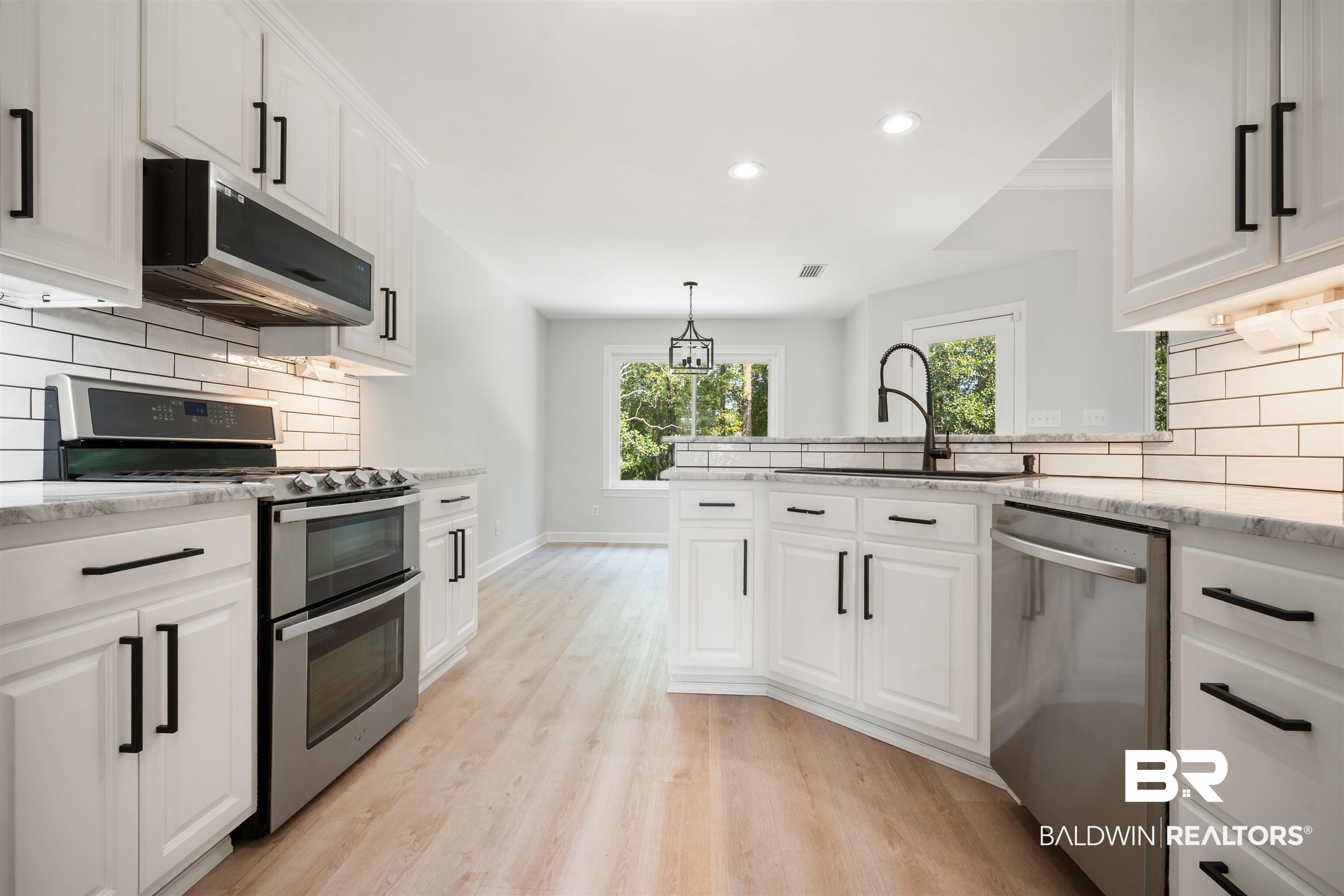 1685 Stonebridge Court Mobile, AL 36695 - Photo 9 of 29 Kitchen featuring decorative backsplash, stainless steel appliances, recessed lighting, and white cabinetry